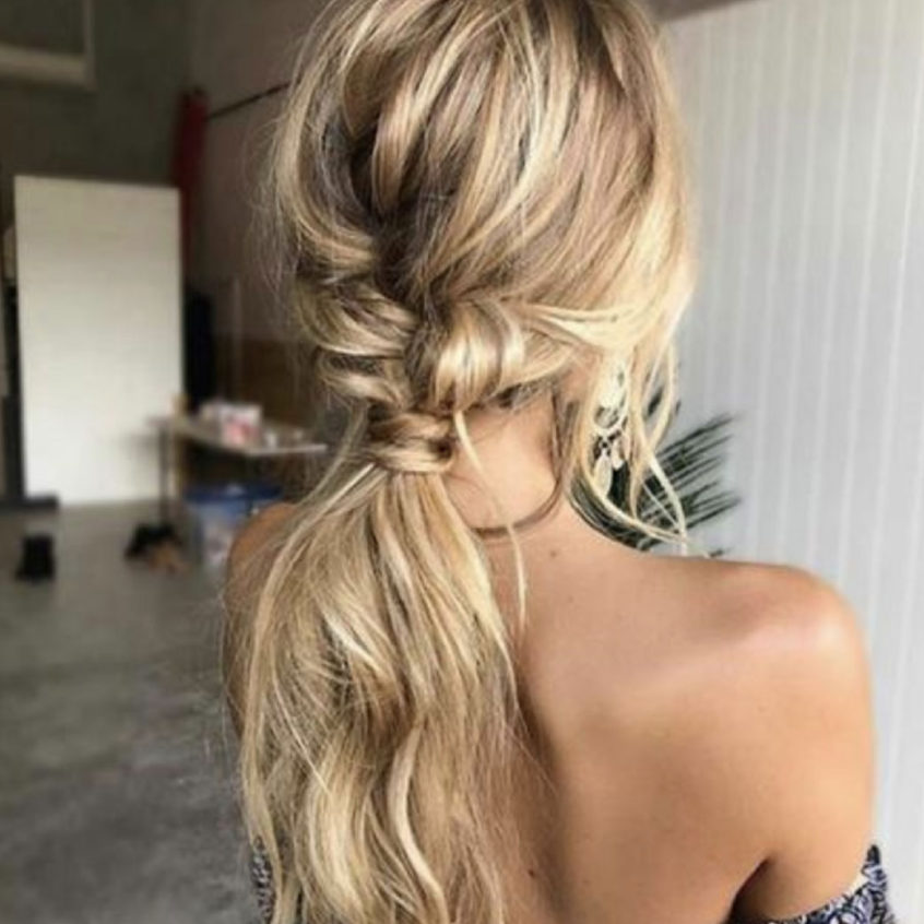 blonde hair girl styled into fancy pony tail