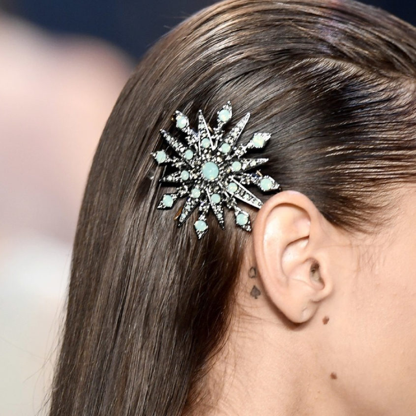 Decorative barrette in slicked back hair