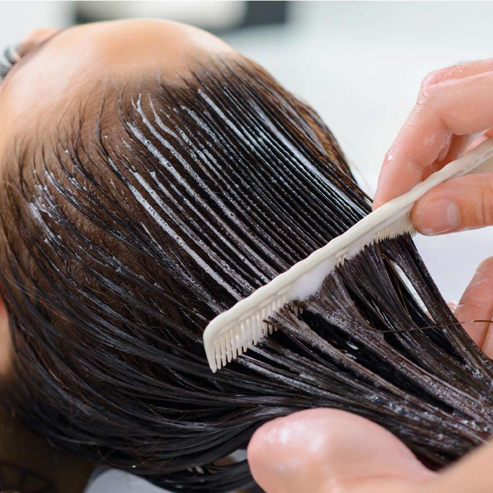 combing through dyed hair