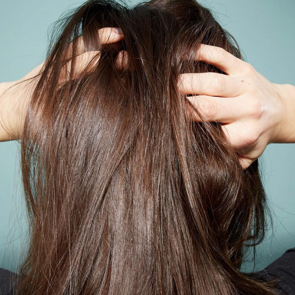 girl with hands in her hair