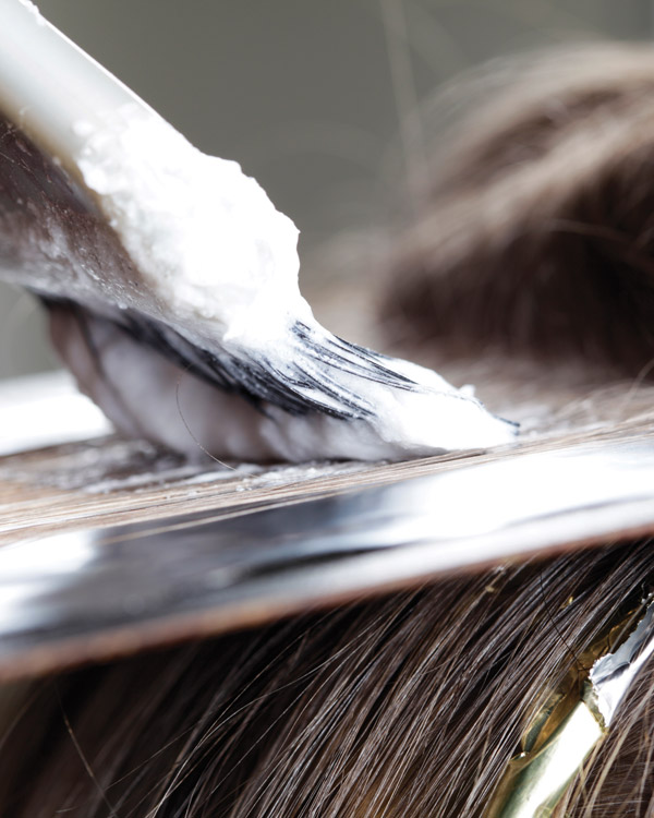 closeup of hair foiling on brown hair